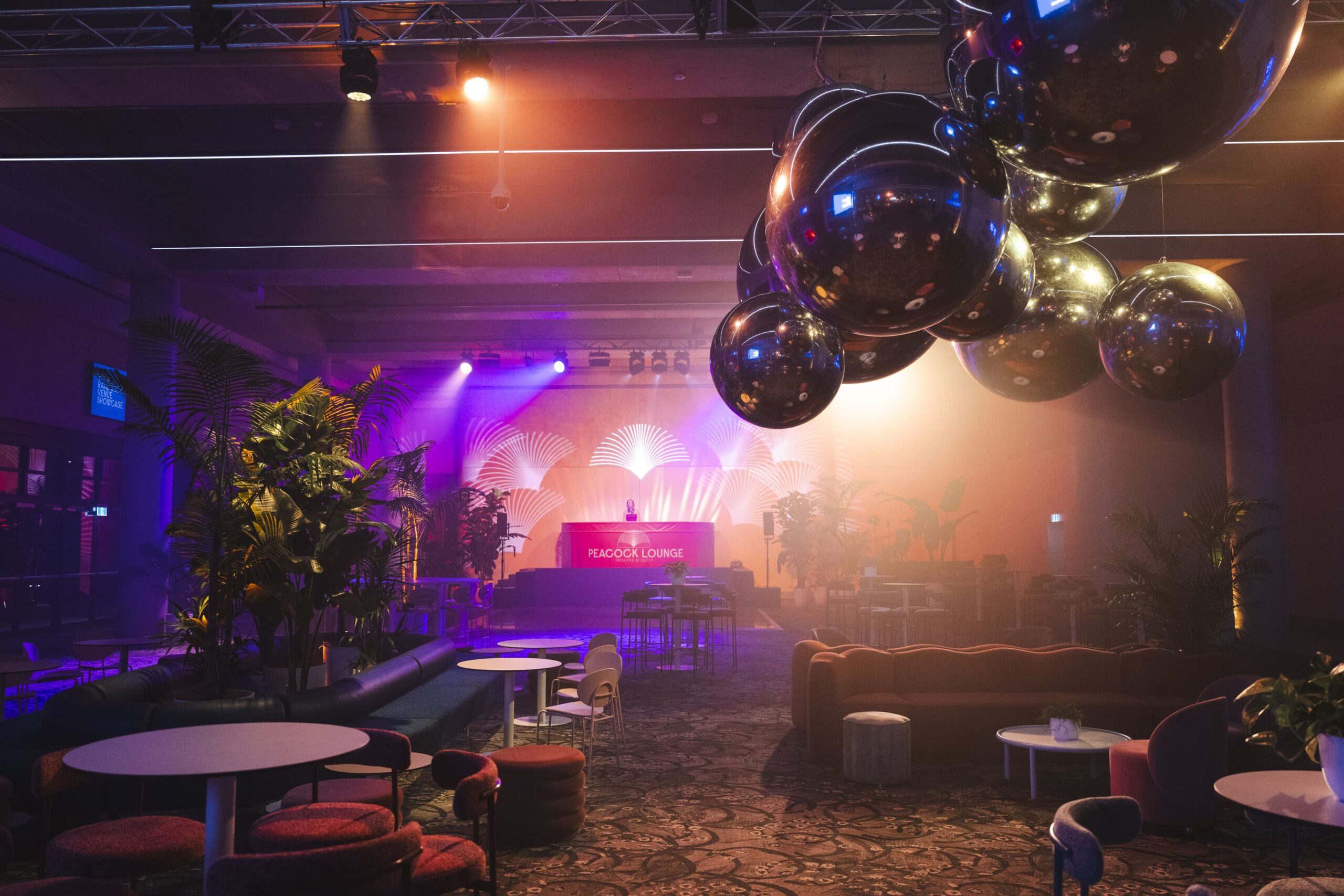 Interior of a function space with mood lights and various decorative components
